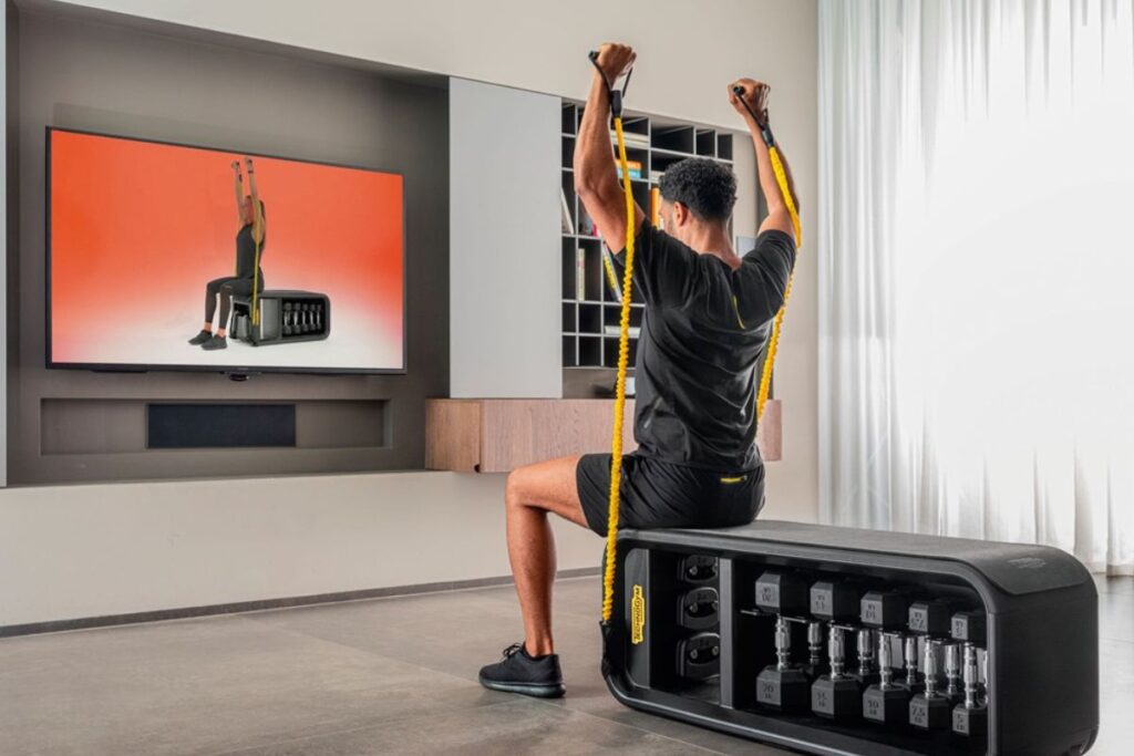 Male working out with Technogym app on Samsung tv